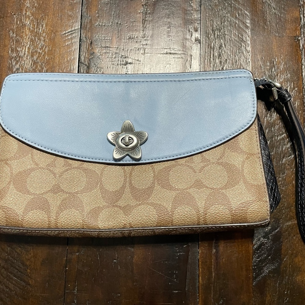 Like new Coach wristlet, signature tan with blue and black accents